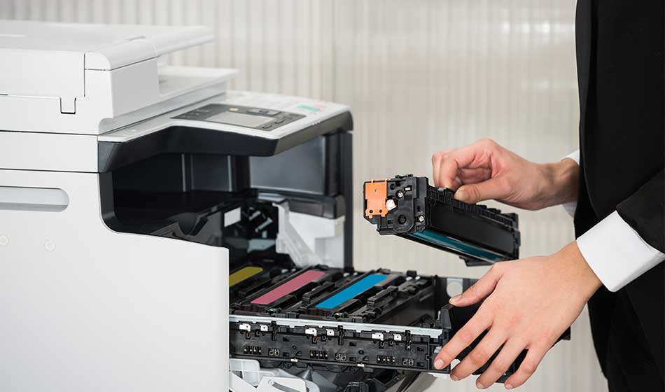 Businessman Fixing Cartridge In Printer Machine At Office