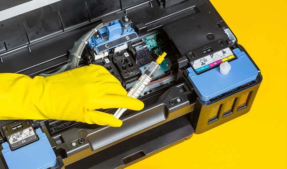 reactivate dried printer cartridges with cleaner and a syringe