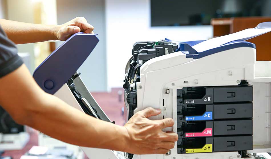 Technician hand open cover photocopier or photocopy to fix paper jam